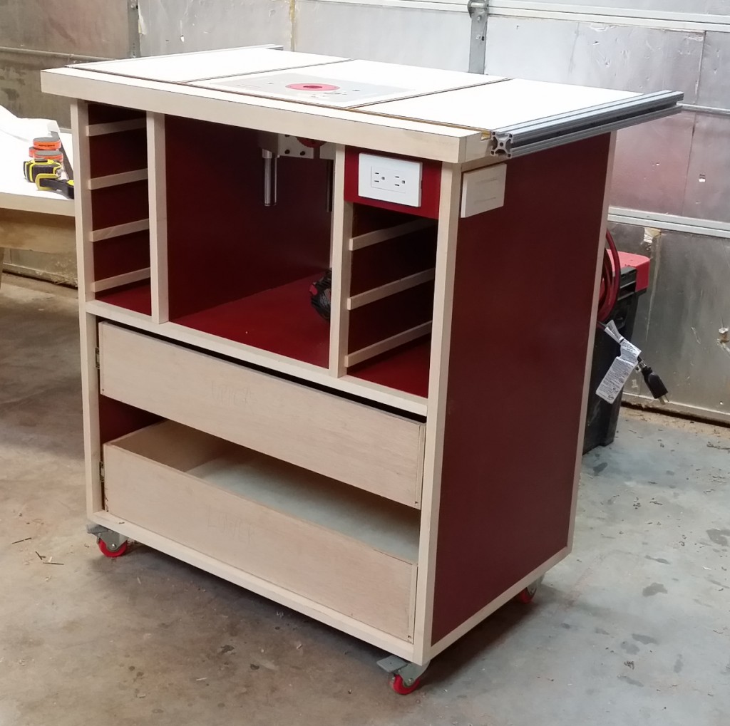 Router table with top and casters attached and router lift installed.